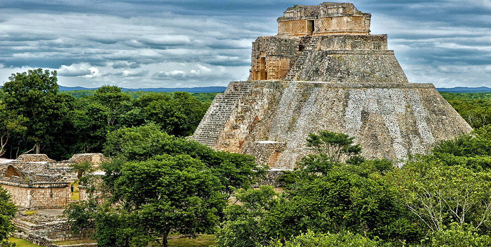 A frontal picture of Templo del Adivino from Uxmal taken from an aereal perspective. 